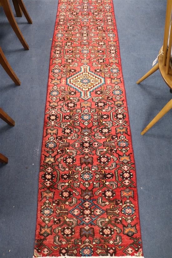 A Hamadan red ground runner, 7ft 1in by 1ft 9in.